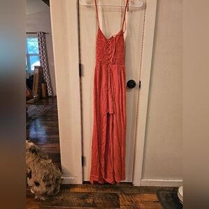 Love Romper size Medium NWOT. Never worn. Coral color